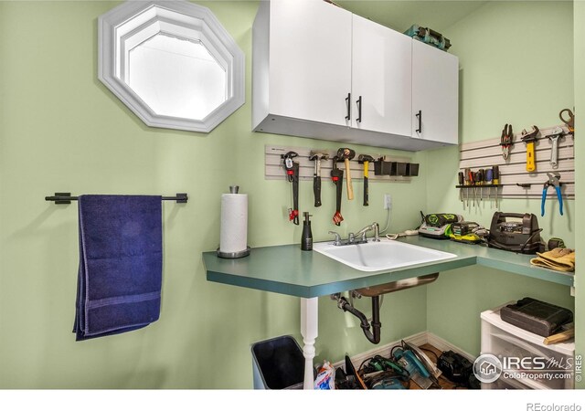 5986 Heather Way, Longmont, CO 80503 - kitchen with a sink and white cabinets
