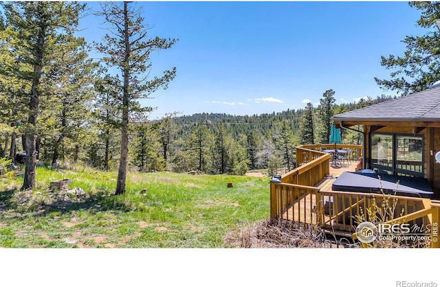 394 Deer Trail Cir, Boulder, CO 80302 - view of yard featuring a forest view and a wooden deck