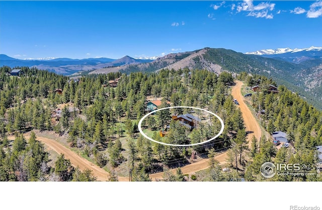 394 Deer Trail Cir, Boulder, CO 80302 - aerial view of a mountain backdrop and a forest
