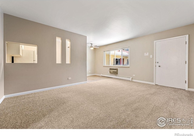 830 20th St Unit 203, Boulder, CO 80302 - spare room with a baseboard radiator, ceiling fan, and carpet floors
