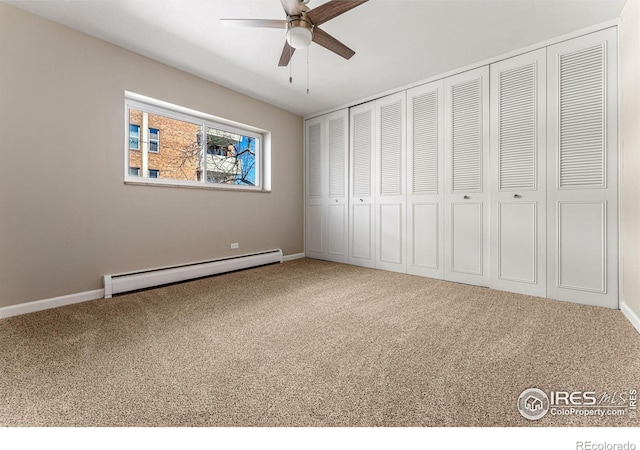 830 20th St Unit 203, Boulder, CO 80302 - unfurnished bedroom with baseboard heating, carpet floors, and a closet
