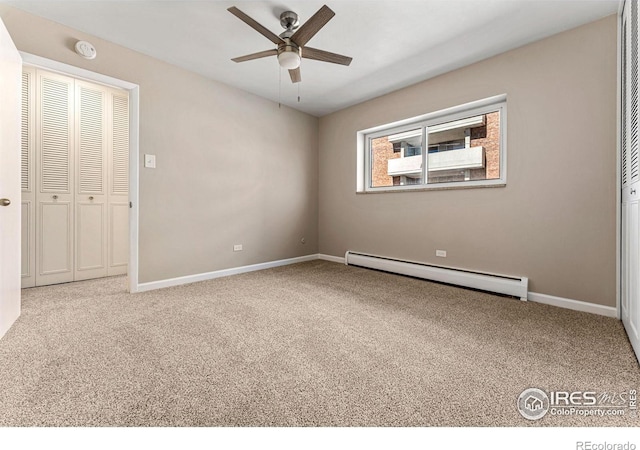 830 20th St Unit 203, Boulder, CO 80302 - unfurnished bedroom with a baseboard radiator, carpet, and ceiling fan