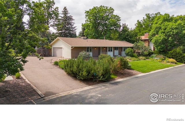 7290 Mount Sherman Rd, Longmont, CO 80503 - ranch-style house featuring driveway and an attached garage