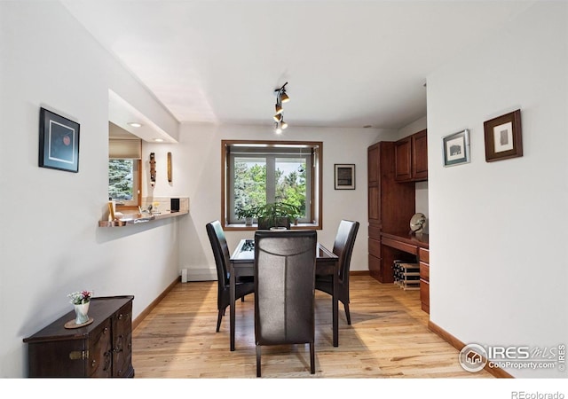 7290 Mount Sherman Rd, Longmont, CO 80503 - dining space with light wood-style floors