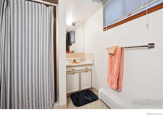 7290 Mount Sherman Rd, Longmont, CO 80503 - full bathroom with vanity, tile patterned floors, and curtained shower