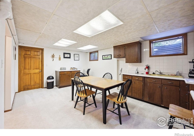 7290 Mount Sherman Rd, Longmont, CO 80503 - dining area with light carpet and a paneled ceiling