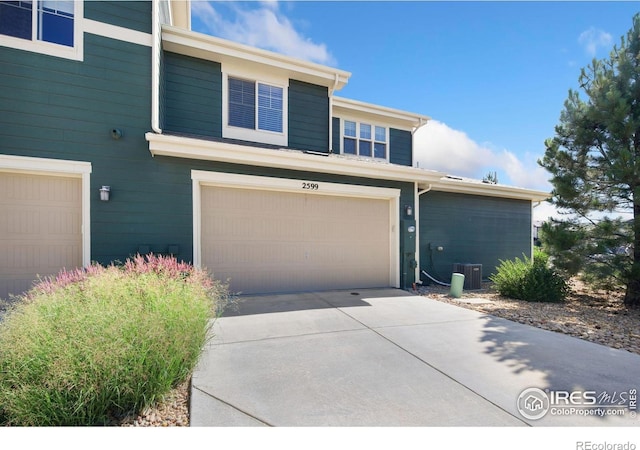 2599 Trio Falls Dr, Loveland, CO 80538 - view of front of property featuring a garage and driveway