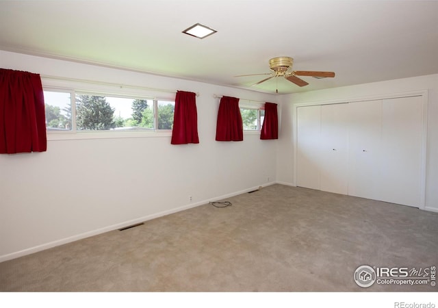 947 Holden Ln, Sterling, CO 80751 - unfurnished bedroom with carpet flooring, a closet, and a ceiling fan