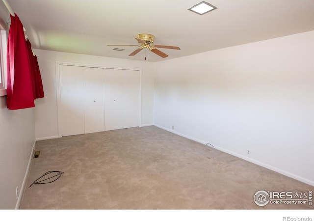 947 Holden Ln, Sterling, CO 80751 - unfurnished bedroom with carpet, a closet, and a ceiling fan