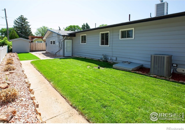 947 Holden Ln, Sterling, CO 80751 - rear view of property featuring a shed and a chimney