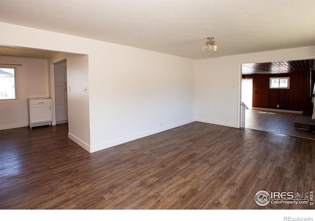 947 Holden Ln, Sterling, CO 80751 - unfurnished room with dark wood finished floors and baseboards