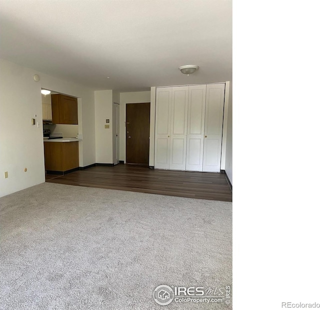 2227 Canyon Blvd Unit 359B, Boulder, CO 80302 - unfurnished living room with dark carpet