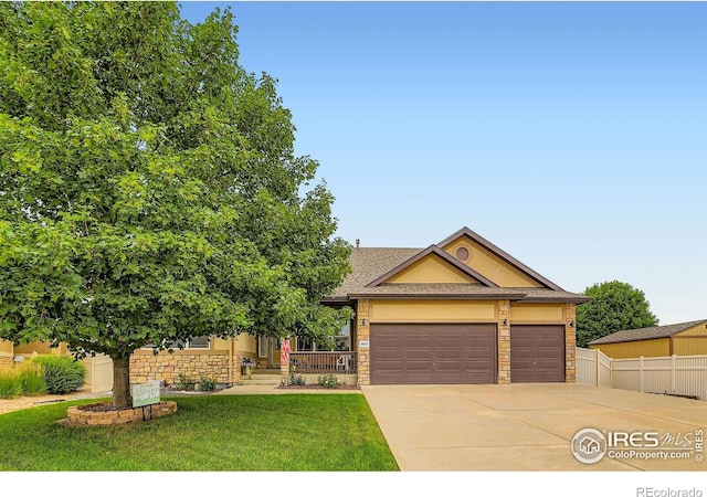 9629 Bountiful St, Firestone, CO 80504 - view of front of house with stone siding, concrete driveway, and a garage