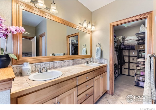 9629 Bountiful St, Firestone, CO 80504 - full bathroom with double vanity, a spacious closet, and tile patterned flooring