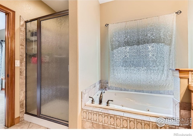 9629 Bountiful St, Firestone, CO 80504 - full bathroom featuring tile patterned flooring, a stall shower, and a tub with jets