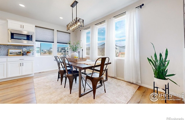 6013 Goodnight Ave, Timnath, CO 80547 - dining room featuring light wood finished floors and recessed lighting