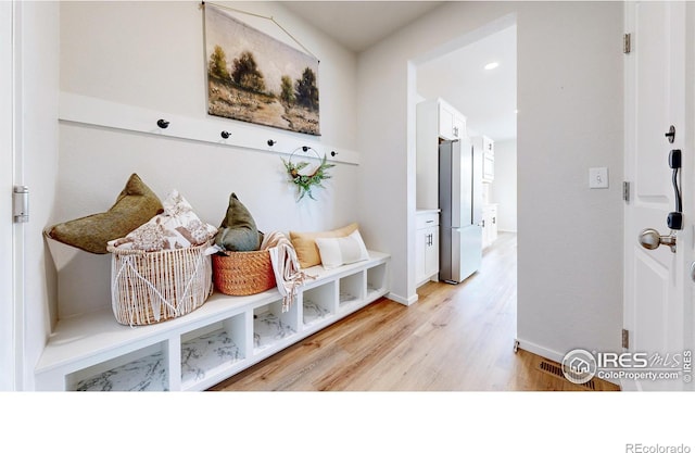 6013 Goodnight Ave, Timnath, CO 80547 - mudroom featuring light wood-type flooring and baseboards