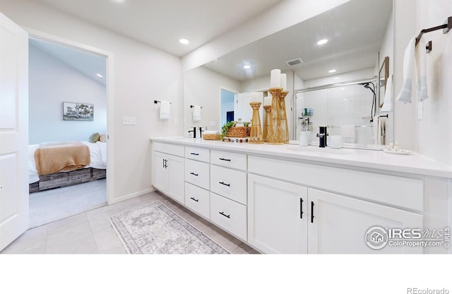 6013 Goodnight Ave, Timnath, CO 80547 - ensuite bathroom featuring double vanity, a shower stall, and recessed lighting