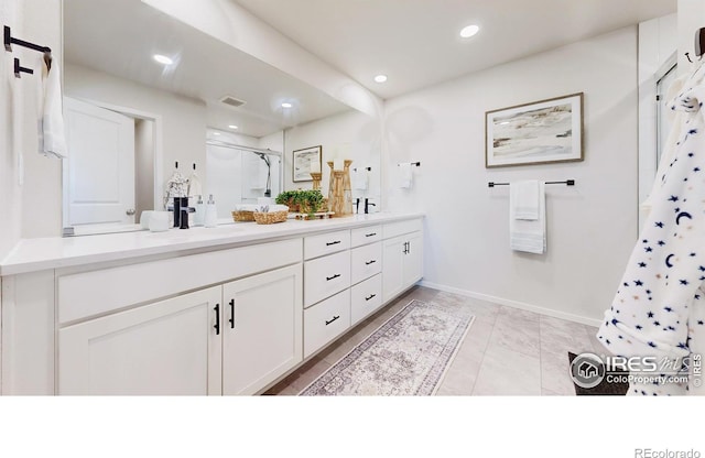 6013 Goodnight Ave, Timnath, CO 80547 - full bathroom featuring a stall shower, double vanity, and recessed lighting