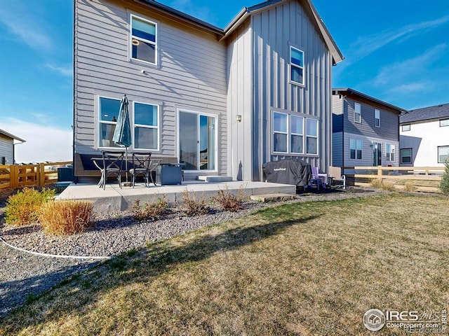 6013 Goodnight Ave, Timnath, CO 80547 - rear view of property featuring board and batten siding and a patio