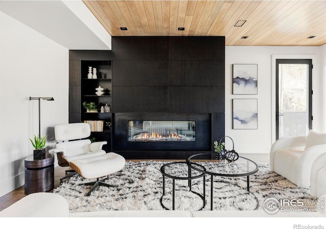 358 Arapahoe Ave Unit B, Boulder, CO 80302 - living area featuring wood ceiling, a multi sided fireplace, built in shelves, and wood finished floors