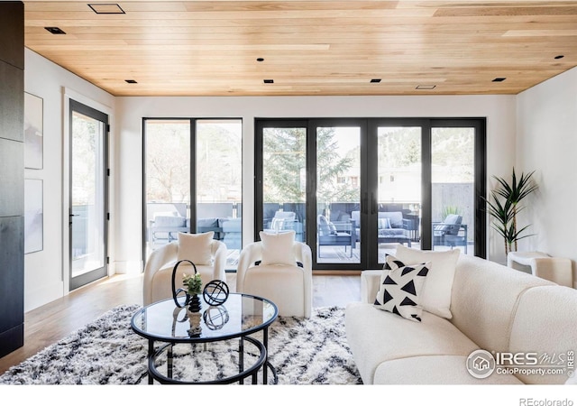 358 Arapahoe Ave Unit B, Boulder, CO 80302 - living room featuring wooden ceiling, healthy amount of natural light, and wood finished floors