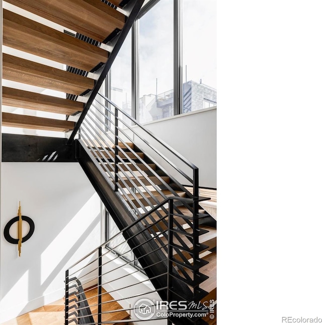 358 Arapahoe Ave Unit B, Boulder, CO 80302 - stairway featuring baseboards