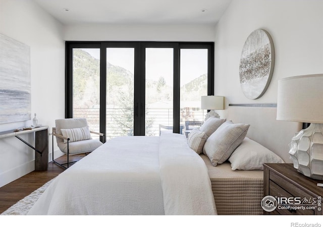 358 Arapahoe Ave Unit B, Boulder, CO 80302 - bedroom featuring wood finished floors, a mountain view, and french doors