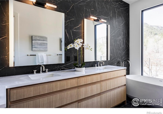 358 Arapahoe Ave Unit B, Boulder, CO 80302 - full bath with a freestanding bath, double vanity, backsplash, and tile walls