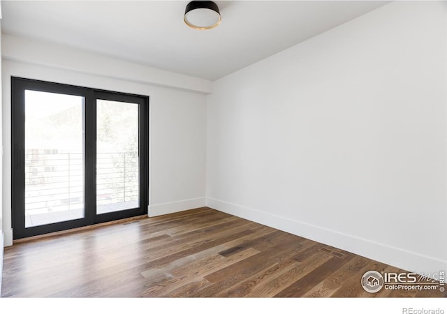358 Arapahoe Ave Unit B, Boulder, CO 80302 - spare room featuring baseboards and wood finished floors
