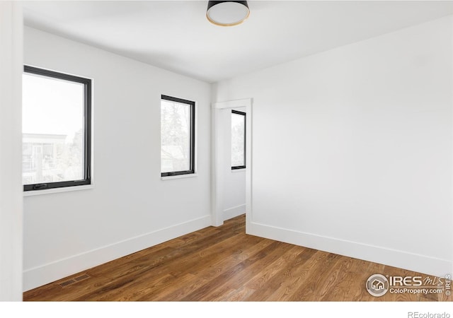 358 Arapahoe Ave Unit B, Boulder, CO 80302 - empty room with baseboards and wood finished floors