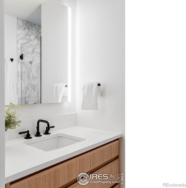 358 Arapahoe Ave Unit B, Boulder, CO 80302 - bathroom with vanity and a marble finish shower