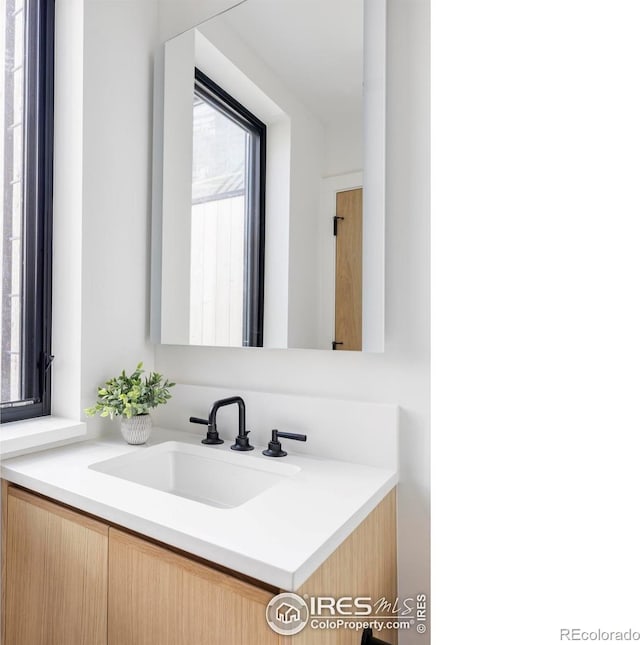 358 Arapahoe Ave Unit B, Boulder, CO 80302 - bathroom featuring healthy amount of natural light and vanity