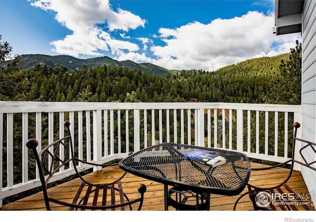 18 Pine St, Jamestown, CO 80455 - wooden deck with a view of trees and a mountain view