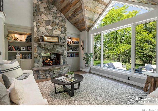 5575 Saint Vrain Rd, Longmont, CO 80503 - living room with a fireplace, wooden ceiling, high vaulted ceiling, and wood finished floors