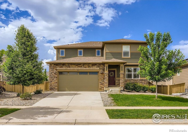 71 Sugar Beet Cir, Longmont, CO 80501 - view of front of property with concrete driveway, stone siding, and an attached garage