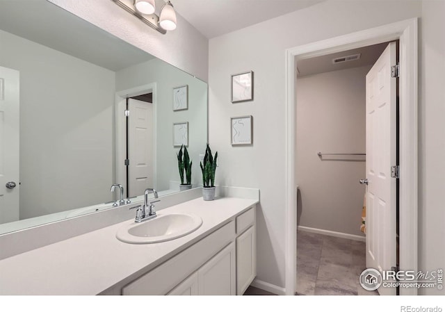 71 Sugar Beet Cir, Longmont, CO 80501 - bathroom featuring vanity and baseboards