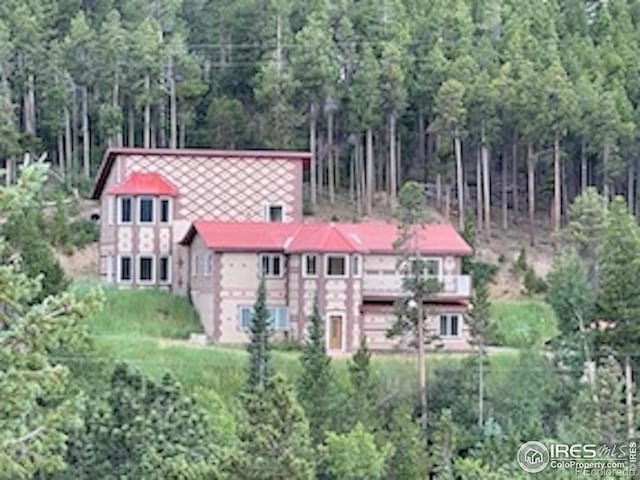 8 Valley View Dr, Nederland, CO 80466 - view of front facade featuring a view of trees