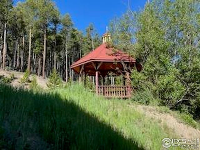 8 Valley View Dr, Nederland, CO 80466 - surrounding community with a gazebo and a wooded view