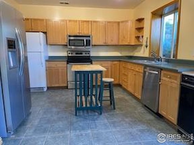 8 Valley View Dr, Nederland, CO 80466 - kitchen with appliances with stainless steel finishes, dark countertops, and open shelves
