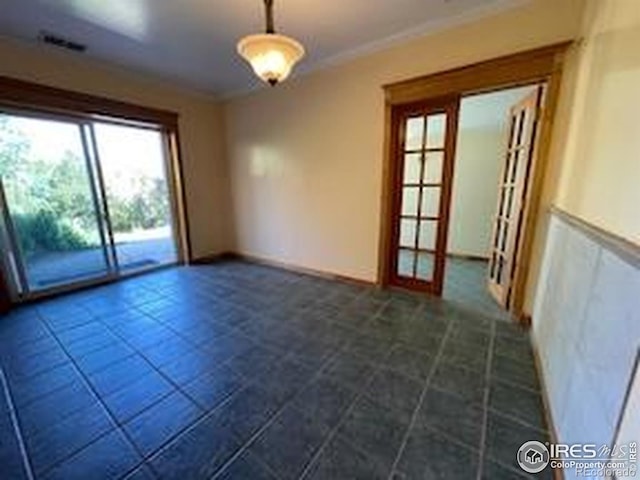 8 Valley View Dr, Nederland, CO 80466 - unfurnished room featuring crown molding, french doors, and dark tile patterned floors