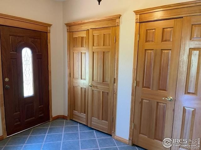 8 Valley View Dr, Nederland, CO 80466 - foyer with baseboards and dark tile patterned flooring