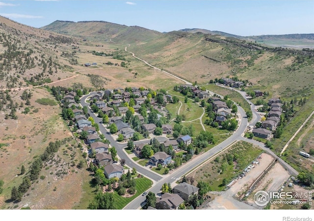 121 Osprey Ln, Lyons, CO 80540 - aerial view of property and surrounding area with a mountainous background and nearby suburban area