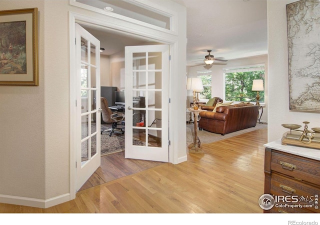 121 Osprey Ln, Lyons, CO 80540 - corridor featuring an office area, french doors, and wood finished floors