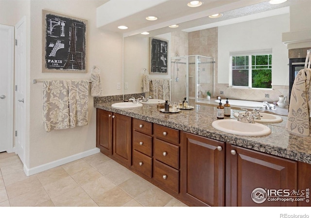 121 Osprey Ln, Lyons, CO 80540 - bathroom featuring a shower stall, double vanity, a bath, tile patterned floors, and recessed lighting