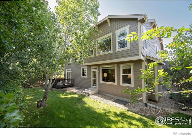 121 Osprey Ln, Lyons, CO 80540 - view of front facade with a front yard and a wooden deck