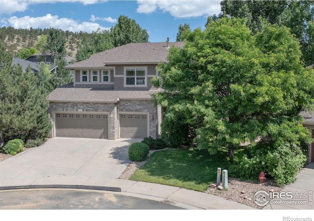 121 Osprey Ln, Lyons, CO 80540 - view of front of home featuring an attached garage, concrete driveway, and a front yard