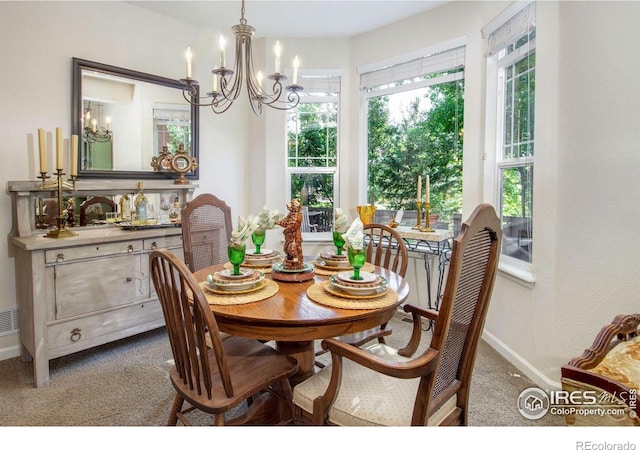121 Osprey Ln, Lyons, CO 80540 - carpeted dining area featuring a chandelier and baseboards