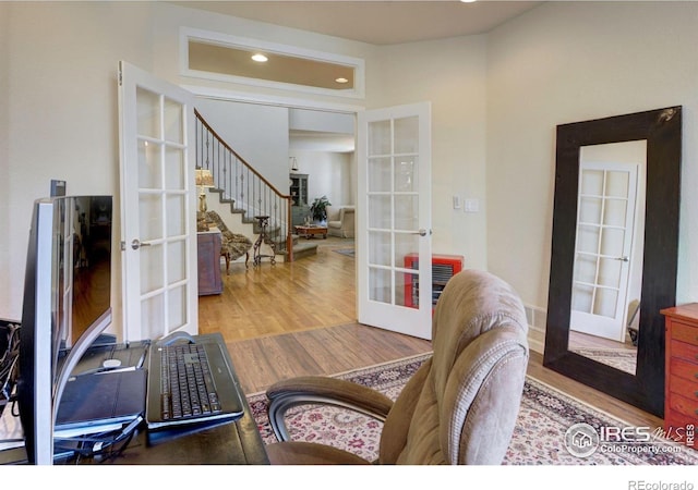 121 Osprey Ln, Lyons, CO 80540 - living room featuring french doors, wood finished floors, recessed lighting, and stairs