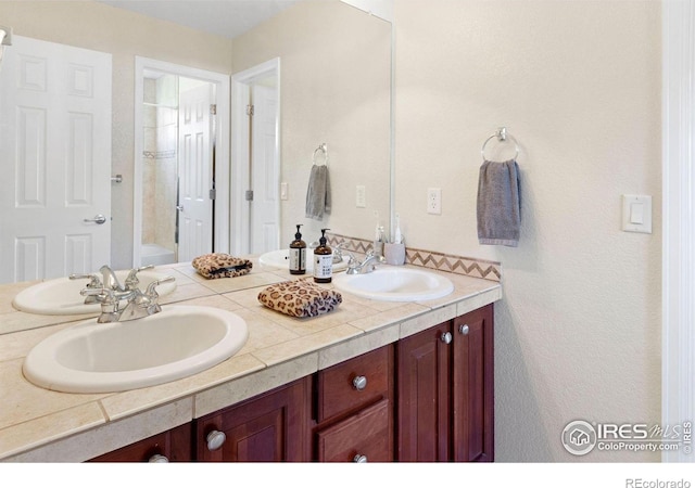 121 Osprey Ln, Lyons, CO 80540 - bathroom featuring double vanity and shower / bathtub combination